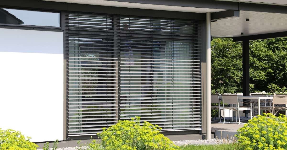 Porch adorned with stylish window blinds for added privacy and charm.