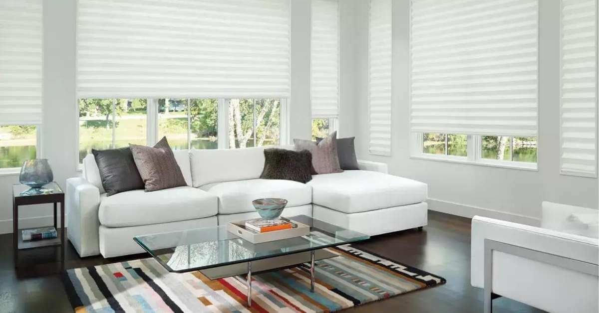 Living room with Hunter Douglas cellular shades effectively blocking heat