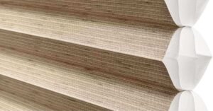 Close-up of Hunter Douglas Cellular Shades, showcasing their honeycomb structure and fabric texture.