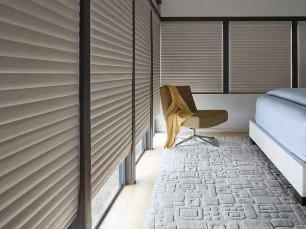 Automated shades can improve insulation by lowering during hot afternoons to block heat or raising on sunny winter days to allow warmth in.